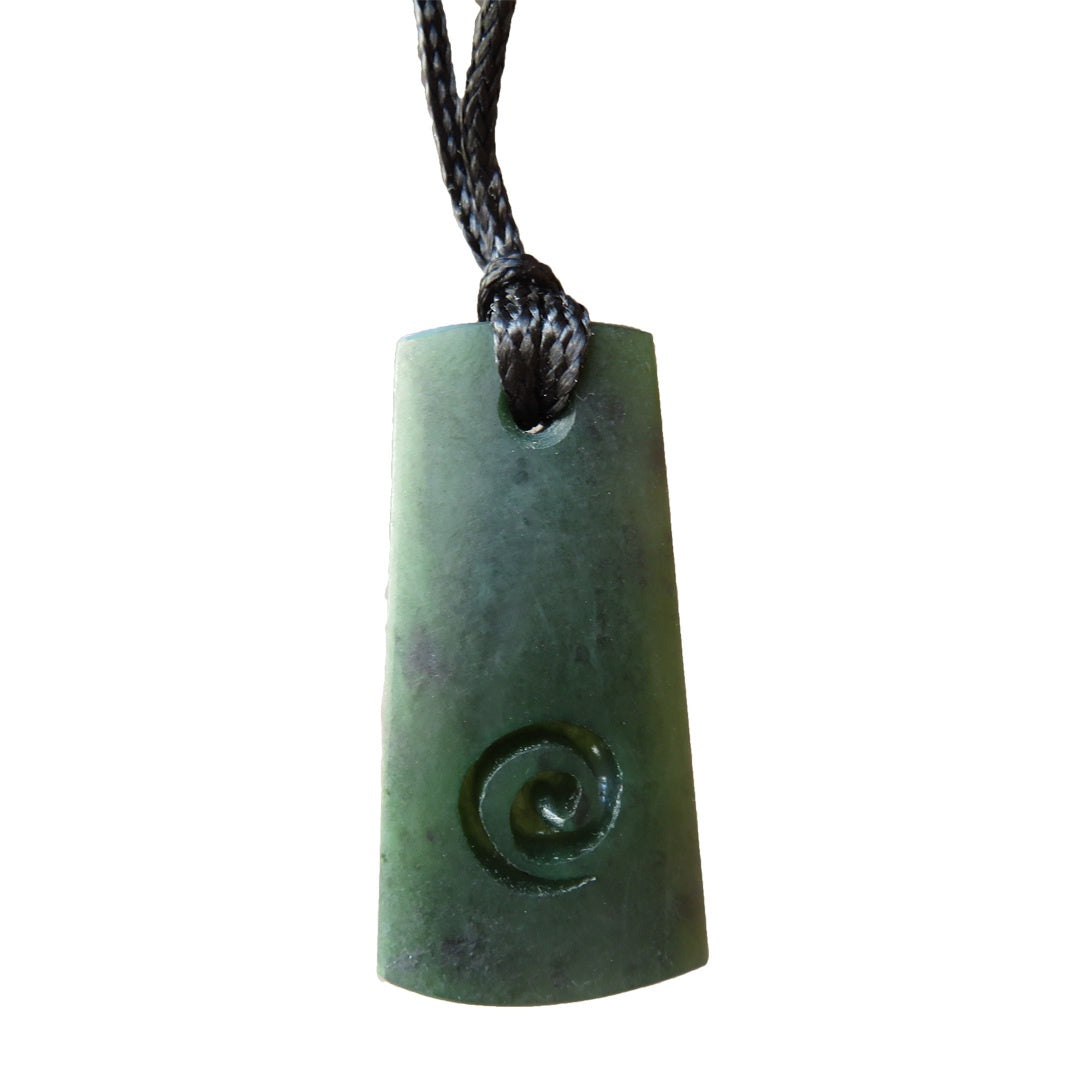 Mana NZ Wedge shaped greenstone pendant with koru carving (4cm) Not specified